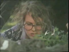 Italian girl with glasses forced from behind on the grass